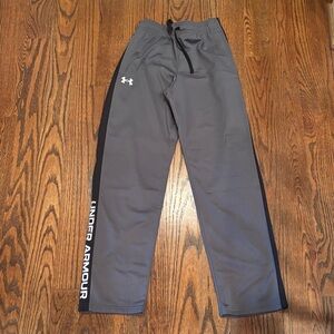 Under Armour boys XL pants. Grey with black strip and white logo.